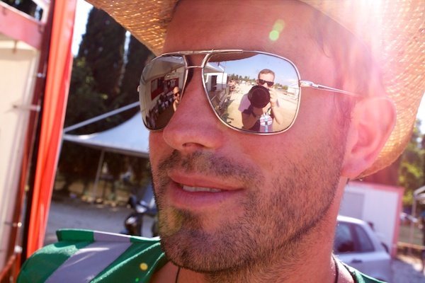 Outlook 2011 13016 A man in a straw hat reflecting the photographer in his sunglasses