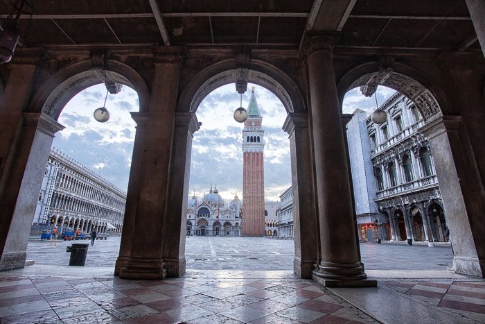 The Piazza San Marco shot through stone arches - Venice pictures